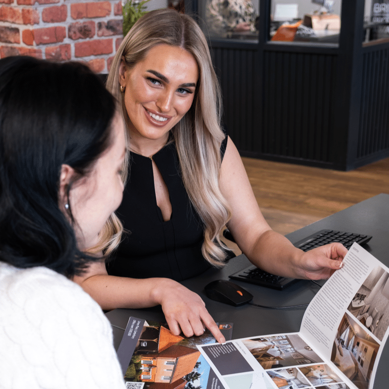 Ladies reviewing brochure